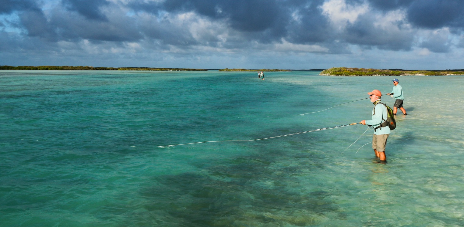Wading for giant trevally with professional fly fishing guides at Alphonse Fishing Co™