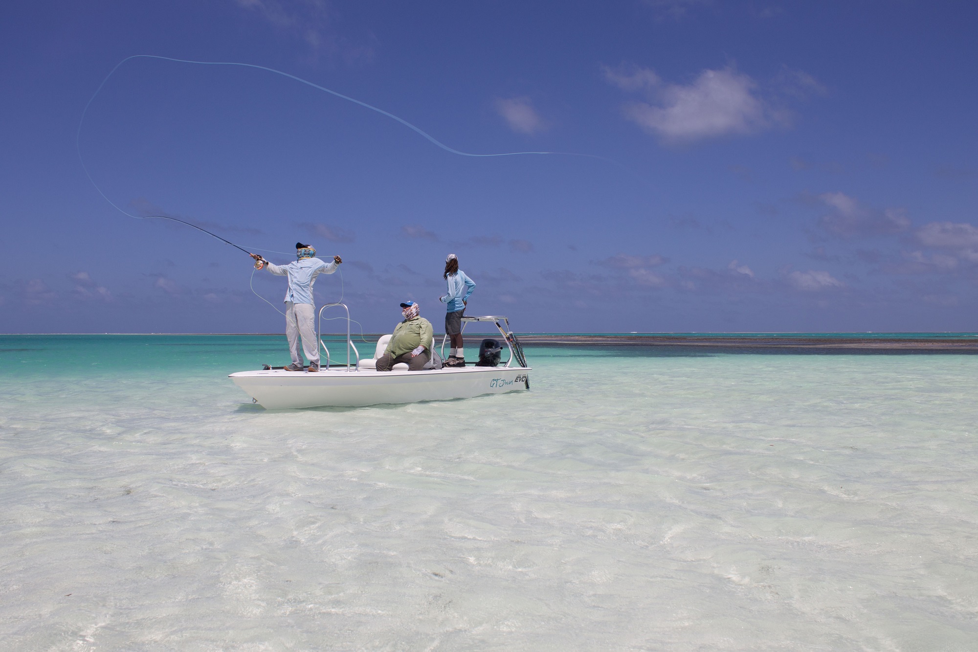 Fly fishing on a skiff with an Alphonse Fish Co™ guide